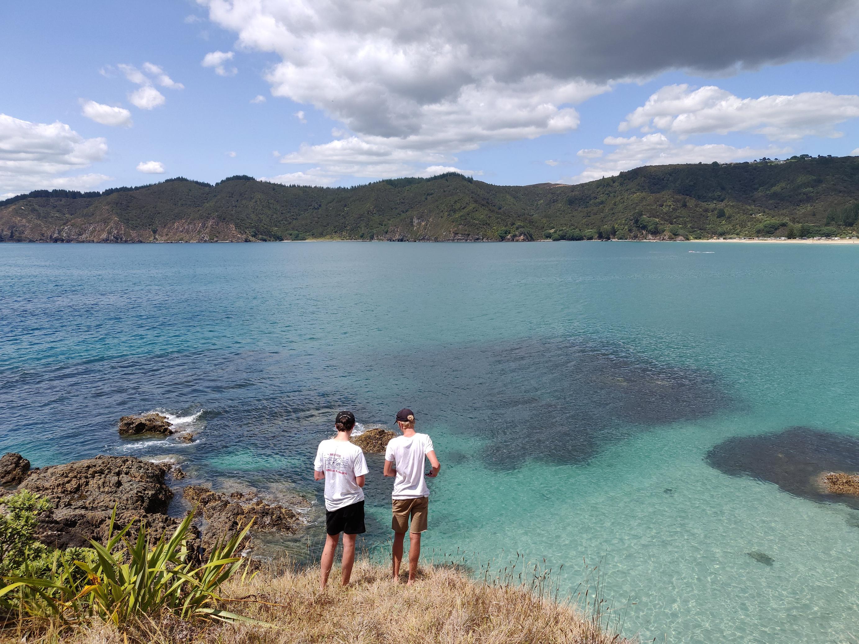 image of two cousins standing admiring the landscape in front of them